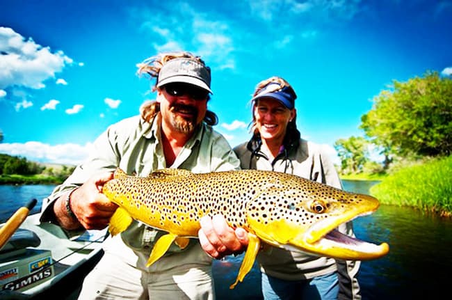 Carter Andrews fishing with his wife Heidi