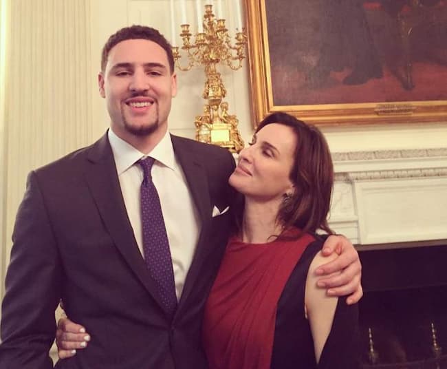 volleyballer Julie Thompson holding her son Klay